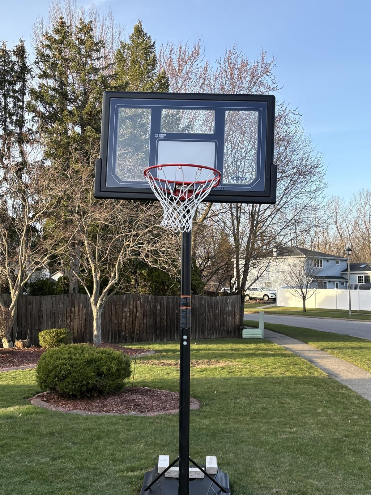 Lifetime 1529 Courtside Height Adjustable Portable Basketball System, 50 Inch Shatterproof Backboard, Black/Red/Blue, Standard customer photo 2