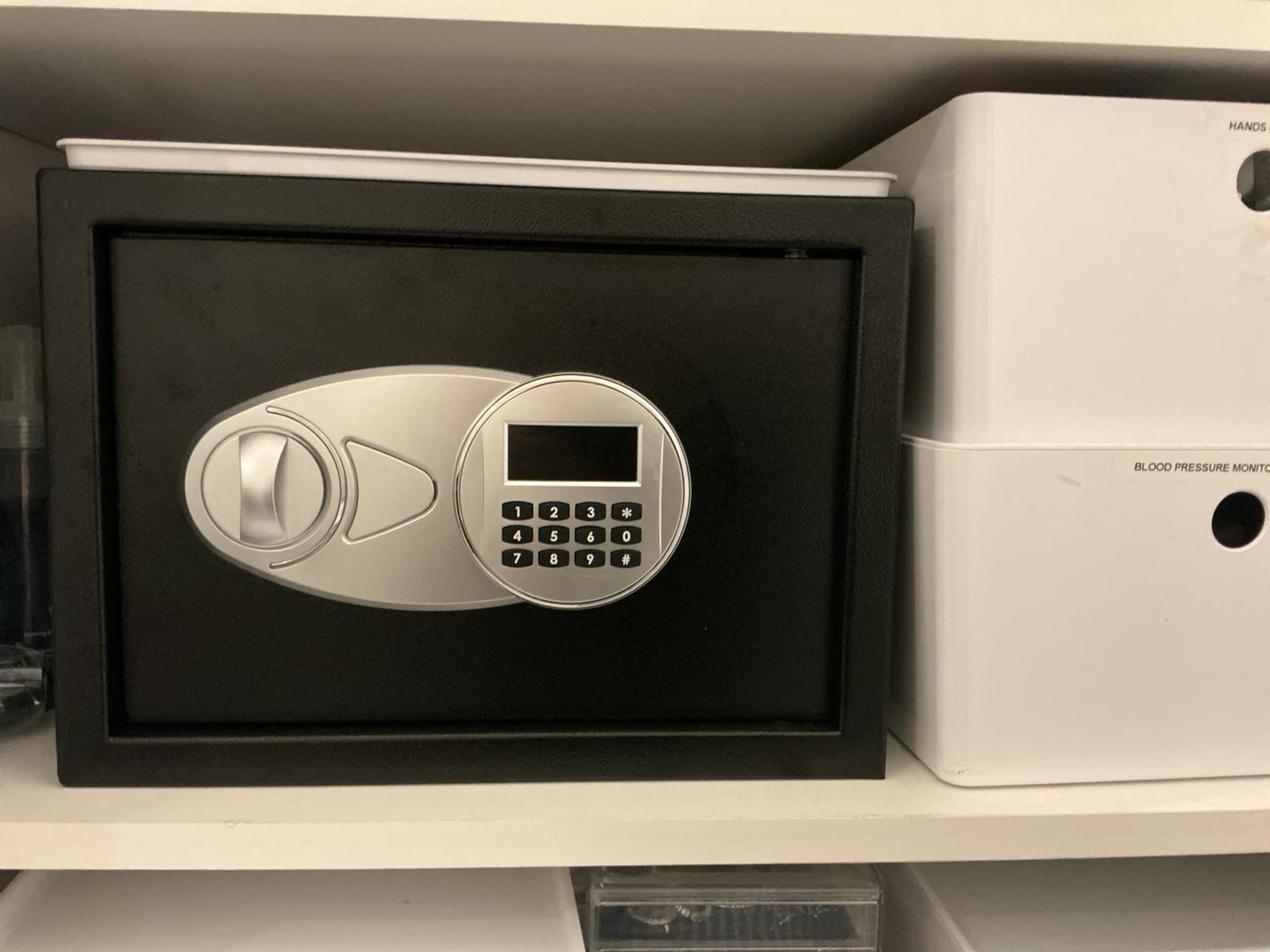 Amazon Basics Steel Security Safe and Lock Box with Digital Keypad, Electronic Lock, Emergency Key Open, Secure Cash, Jewelry, Documents, Black, 0.7 Cubic Feet, 16.9-x-14.6-x-7.1-inches (WxDxH) customer photo 1
